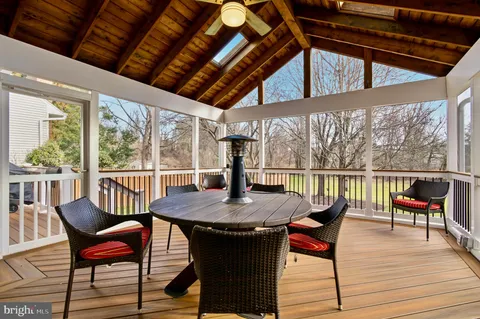 a spacious bedroom with a bed and a chandelier