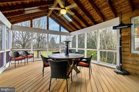 a view of a workspace with furniture and closet