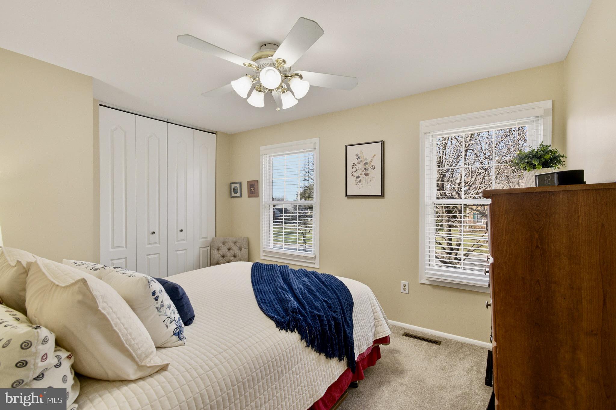 4705 Ilkley Moor Lane Ellicott City, MD 21043 - Photo 36 of 69 a bedroom with a bed chandelier and a window