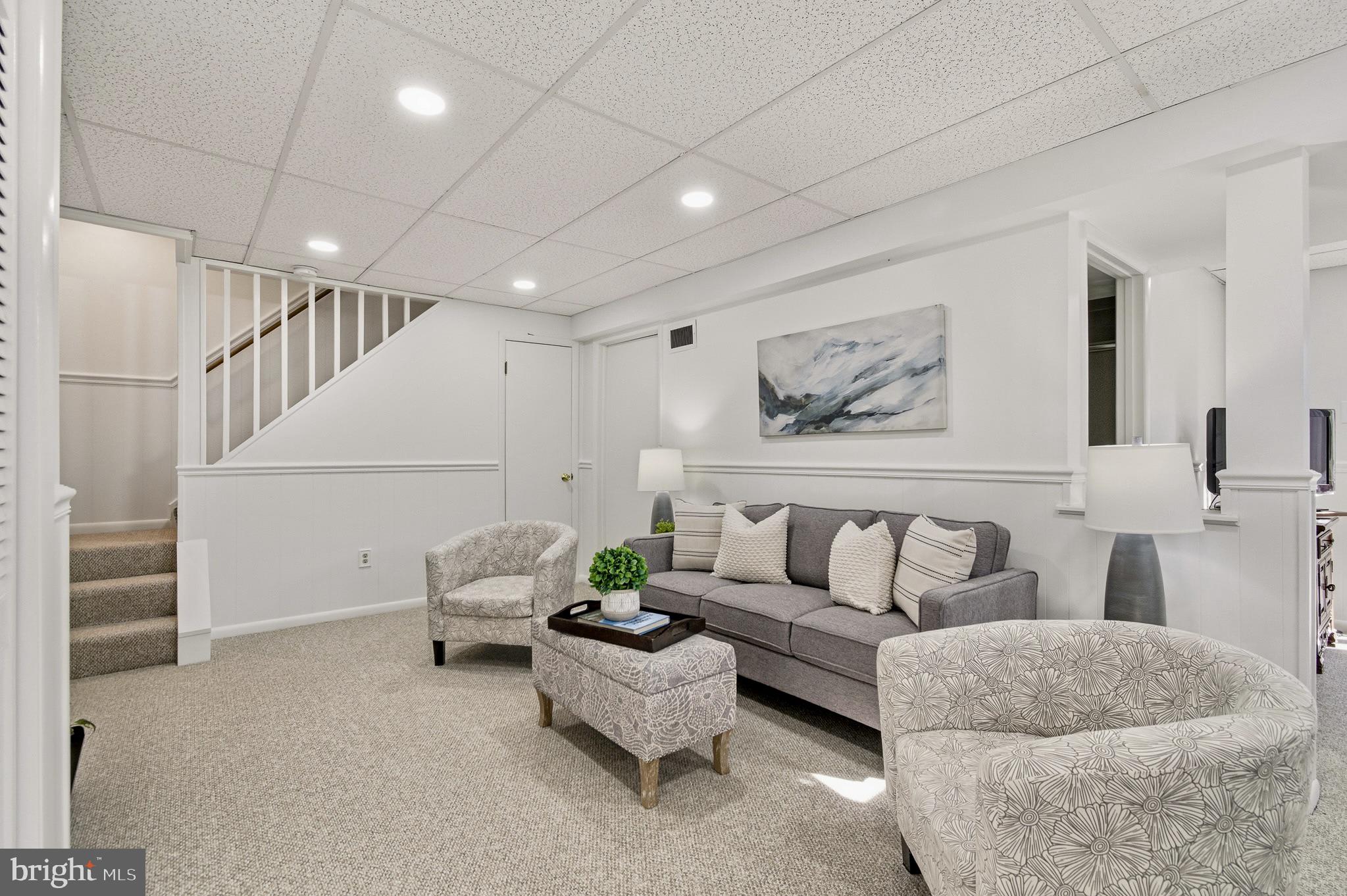 4705 Ilkley Moor Lane Ellicott City, MD 21043 - Photo 41 of 69 a living room with furniture and white walls