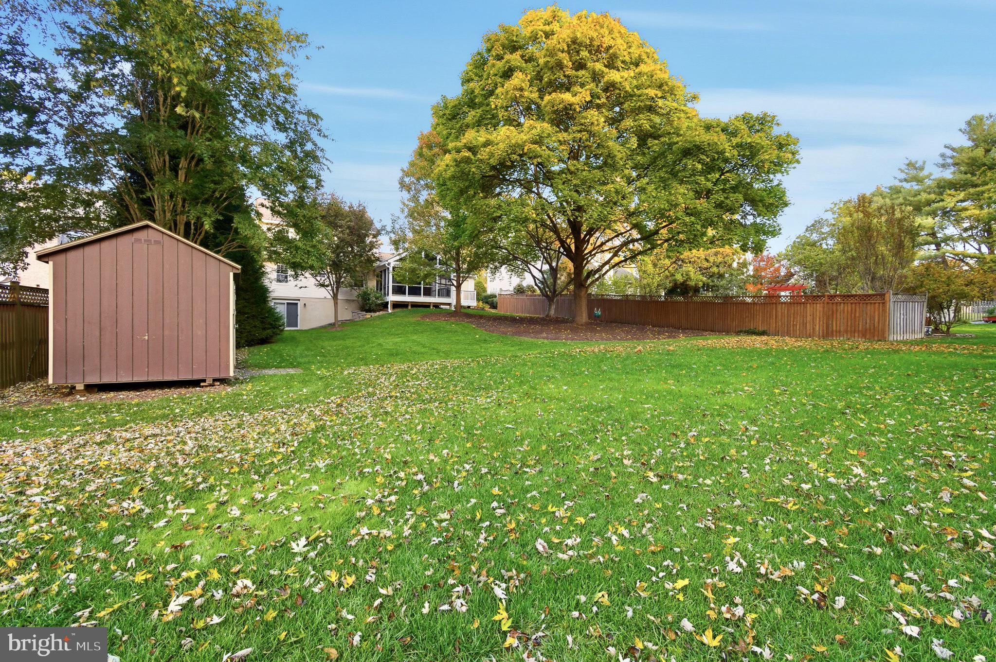 4705 Ilkley Moor Lane Ellicott City, MD 21043 - Photo 58 of 69 a view of a backyard with large trees