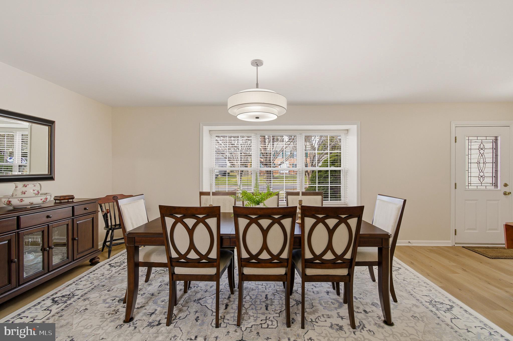 4705 Ilkley Moor Lane Ellicott City, MD 21043 - Photo 6 of 69 a view of a dining room with furniture window and outside view