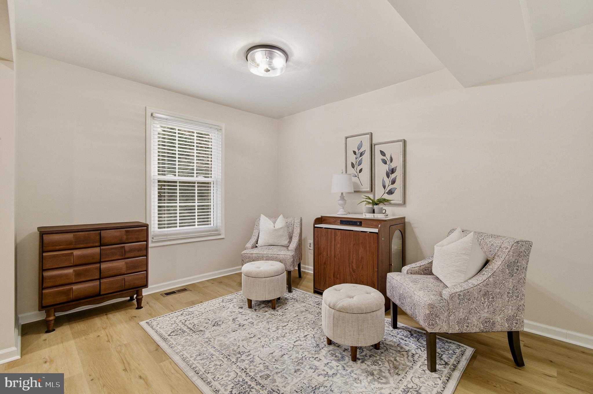 4705 Ilkley Moor Lane Ellicott City, MD 21043 - Photo 7 of 69 a living room with furniture and wooden floor