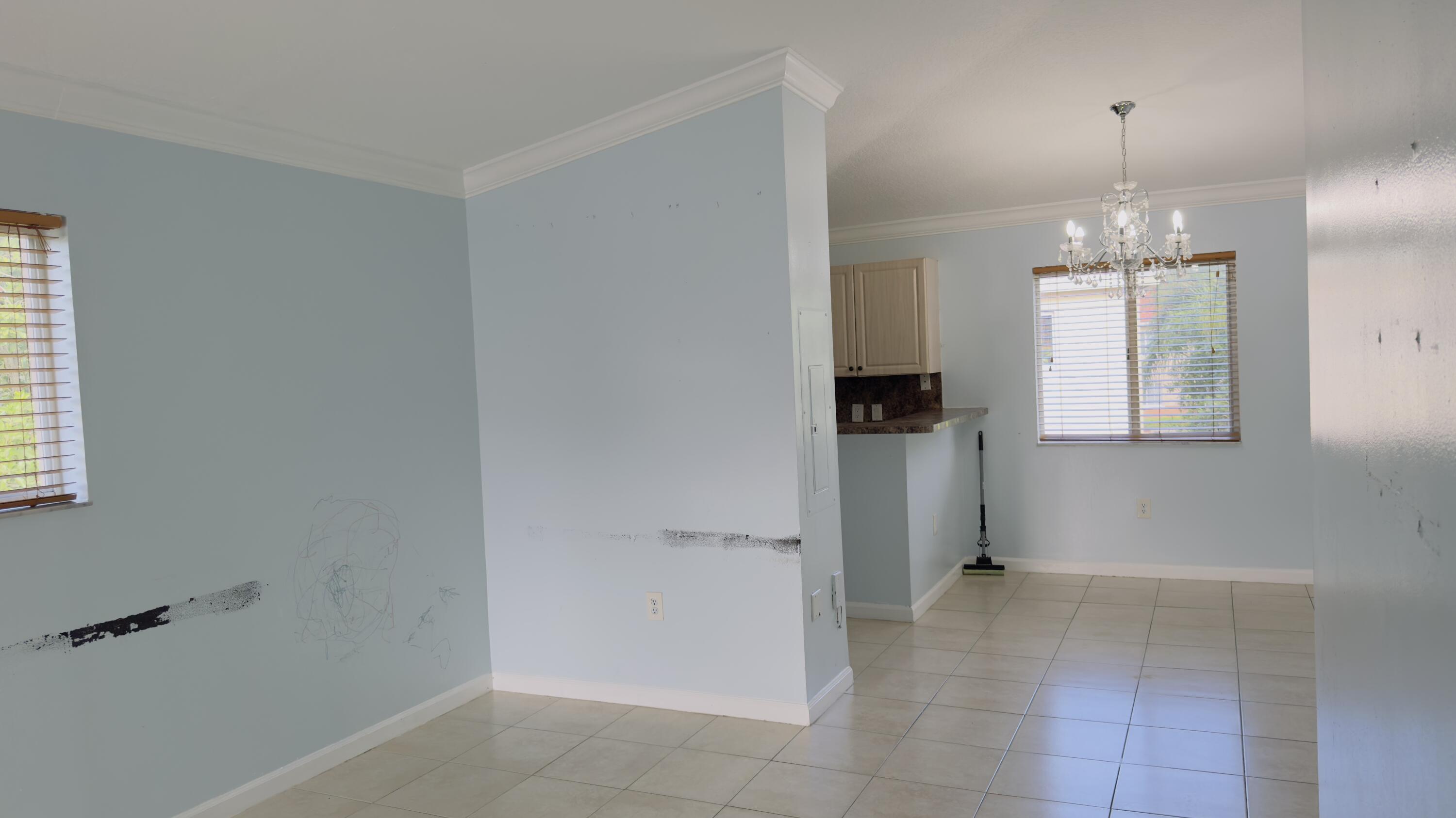 3481 Briar Bay Boulevard, Unit 201 West Palm Beach, FL 33411 - Photo 11 of 19 a view of a kitchen and window