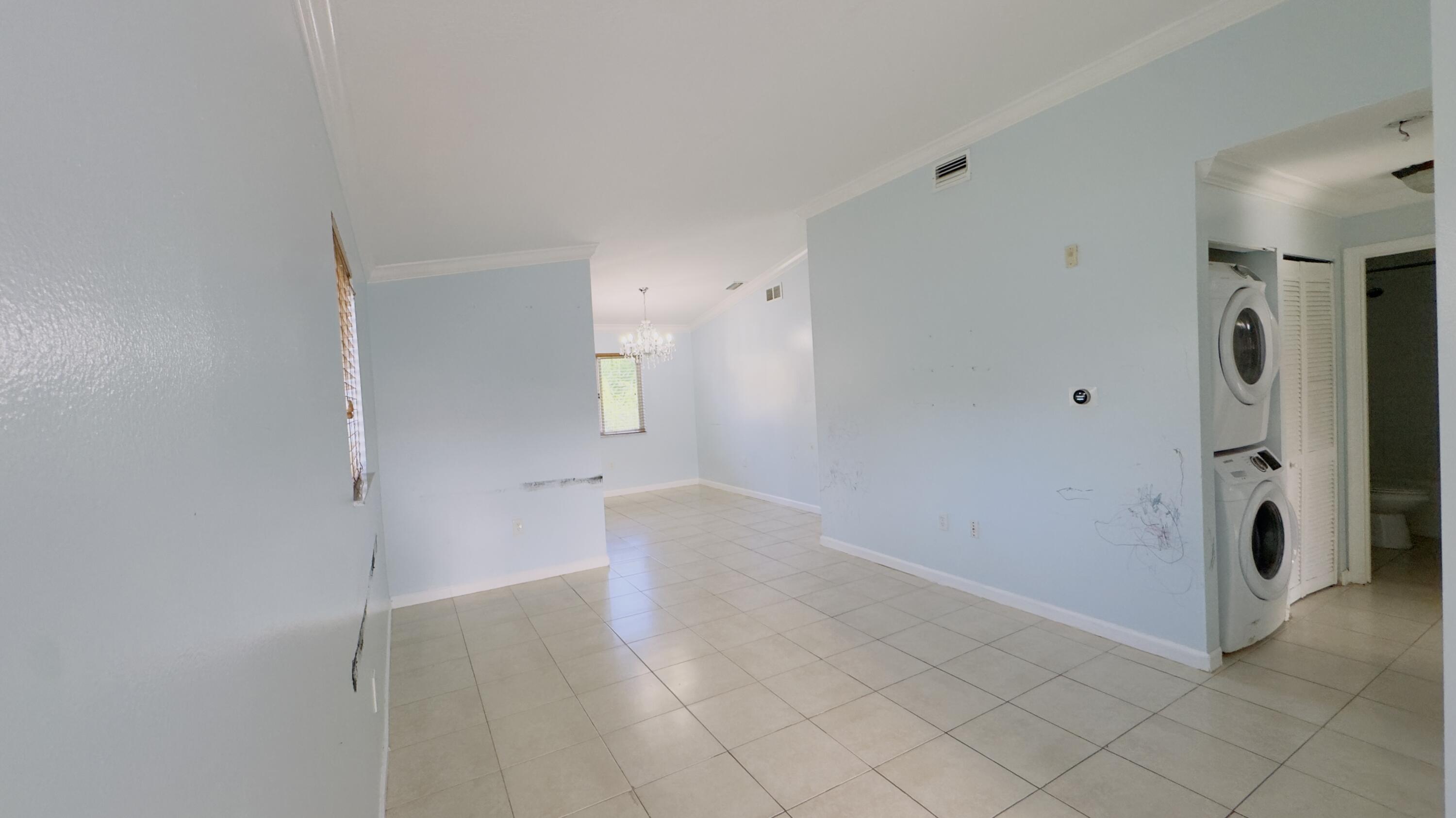 3481 Briar Bay Boulevard, Unit 201 West Palm Beach, FL 33411 - Photo 12 of 19 a view of an empty room
