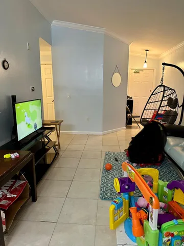 a room with toys and a flat screen tv