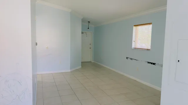 a view of an empty room with closet