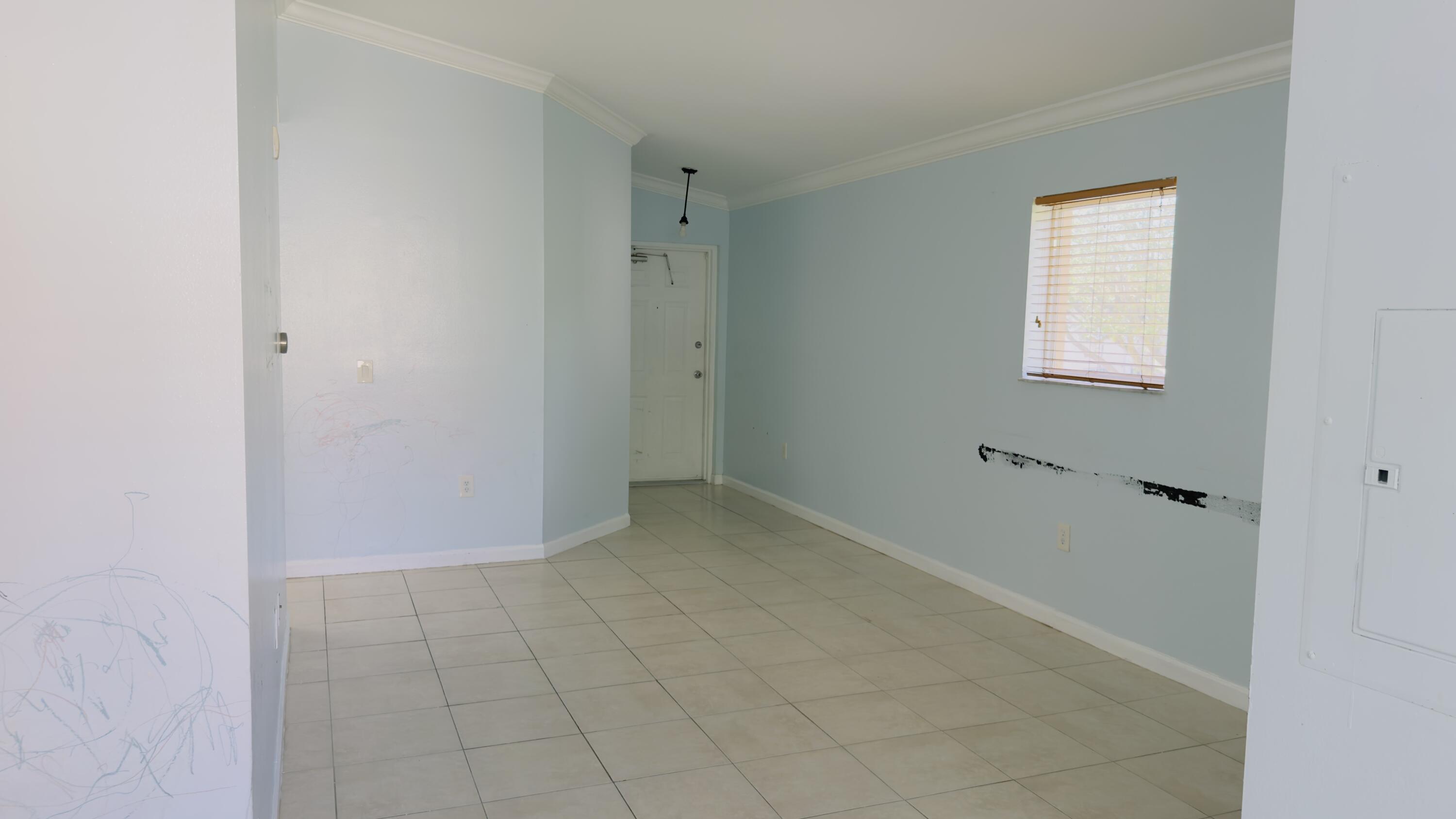 3481 Briar Bay Boulevard, Unit 201 West Palm Beach, FL 33411 - Photo 8 of 19 a view of an empty room with closet