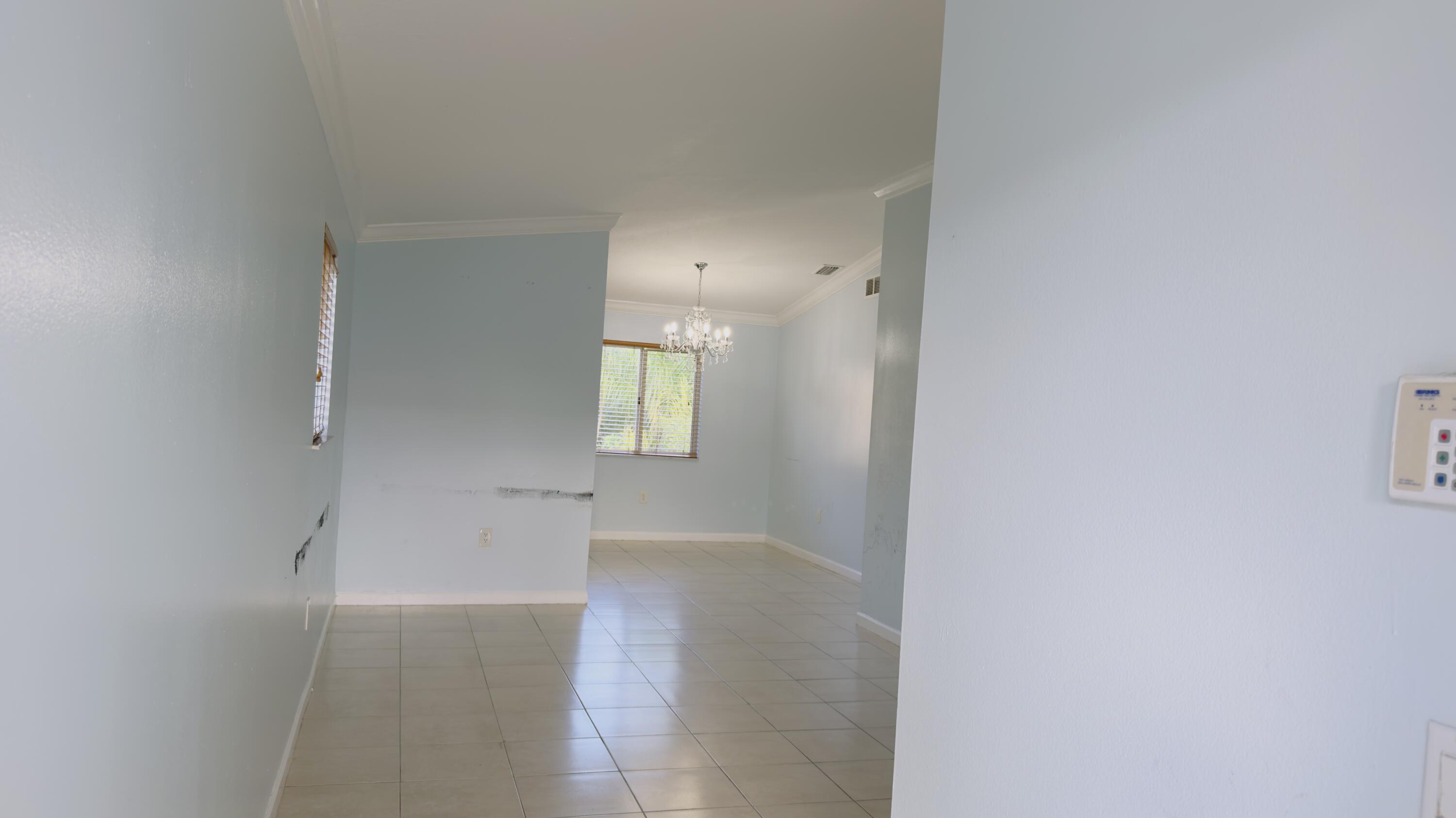 3481 Briar Bay Boulevard, Unit 201 West Palm Beach, FL 33411 - Photo 9 of 19 a view of a room that has a window