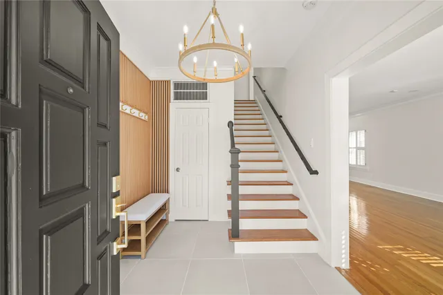 a view of entryway and hall with wooden floor