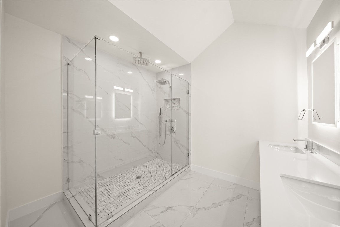 2008 Dryden Road Houston, TX 77030 - Photo 15 of 16 a bathroom with a shower and a sink