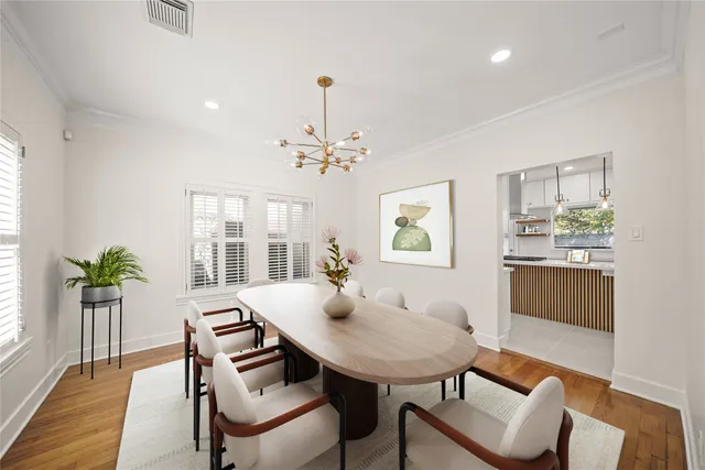 a view of a dining room with furniture and window