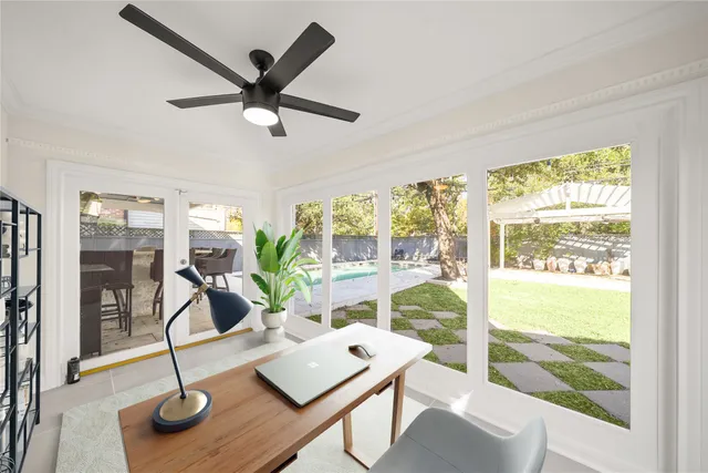 a living room with furniture a window and a table