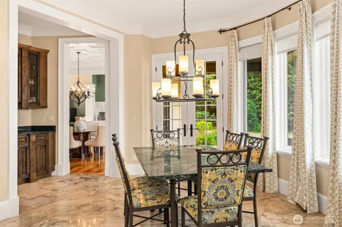 a view of a dining room with furniture window and outside view