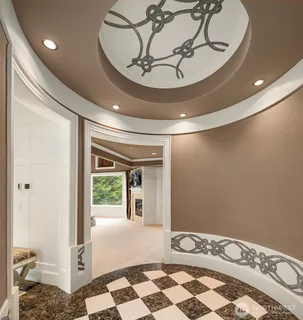 a bed room with bed and a large window