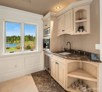 a bathroom with a double vanity sink mirror and double