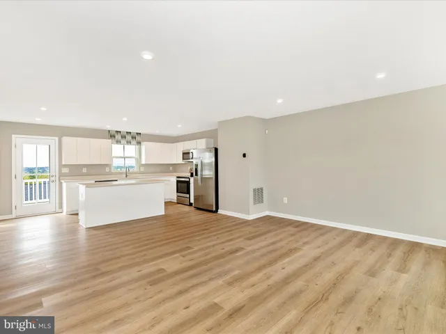 a view of kitchen with wooden floor