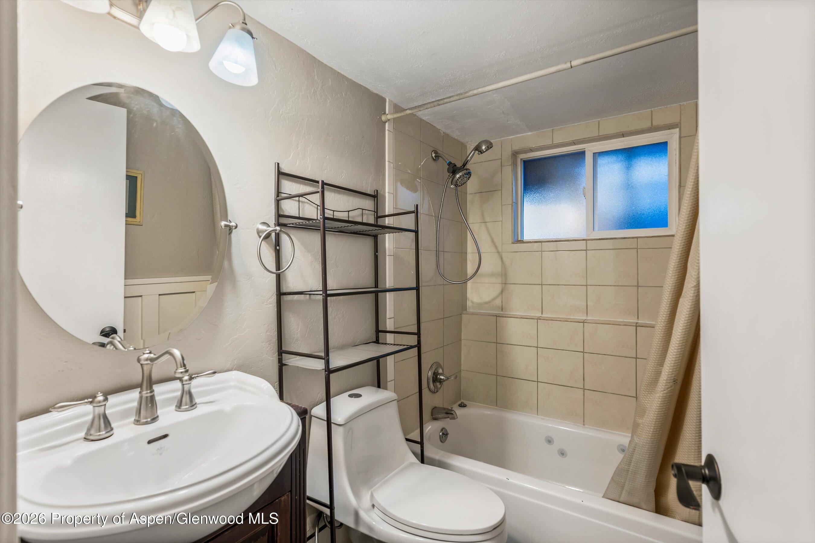 805 Munro Avenue Rifle, CO 81650 - Photo 12 of 23 a bathroom with a sink toilet and shower
