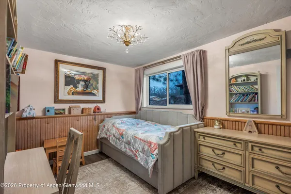 a bedroom with a bed and furniture