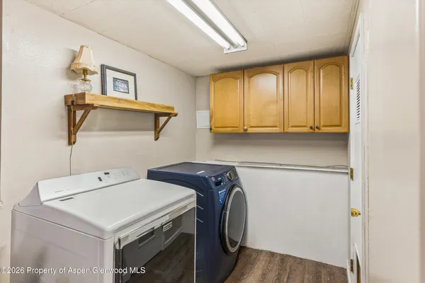 a utility room with dryer and washer