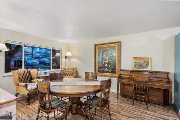a view of a dining room with furniture and window