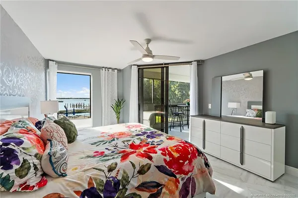 a bathroom with a sink shower and a mirror