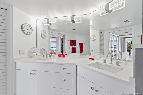 a bedroom with a bed and flat screen tv