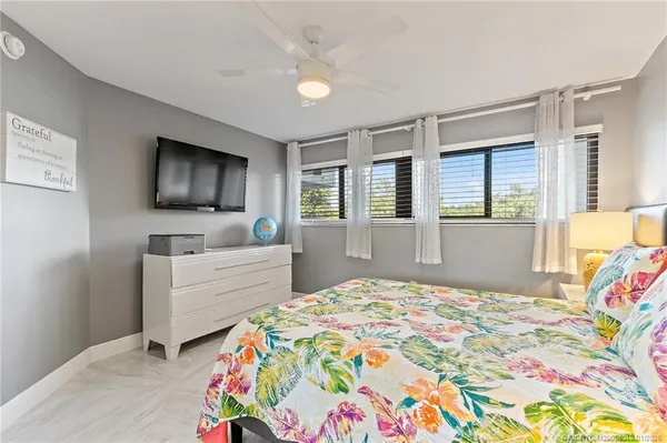 a bathroom with a sink a mirror and a toilet