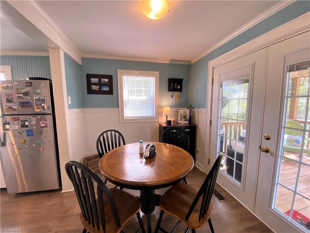 206 Lonesome Road Madison, NC 27025 - Photo 11 of 40 Dining room with door to screened porch