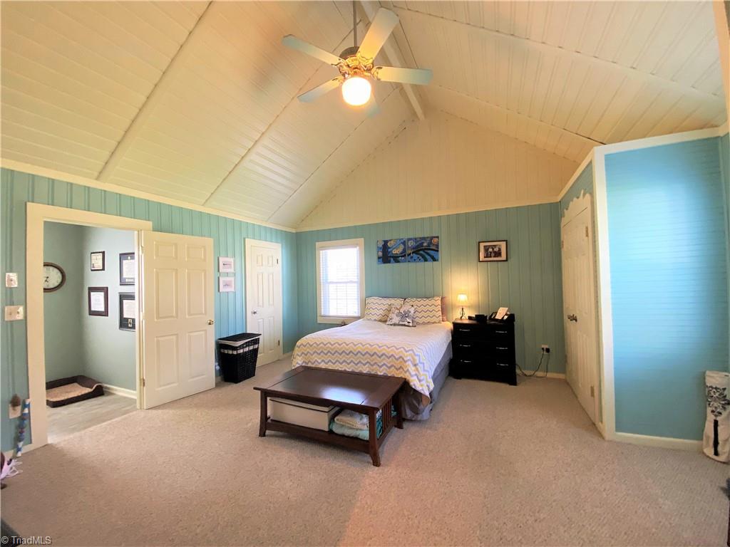 206 Lonesome Road Madison, NC 27025 - Photo 14 of 40 Primary bedroom with lovely vaulted ceiling