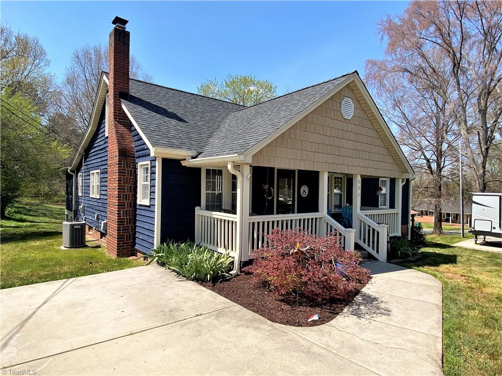 206 Lonesome Road Madison, NC 27025 - Photo 30 of 40 Paved driveway and walkway to covered porch