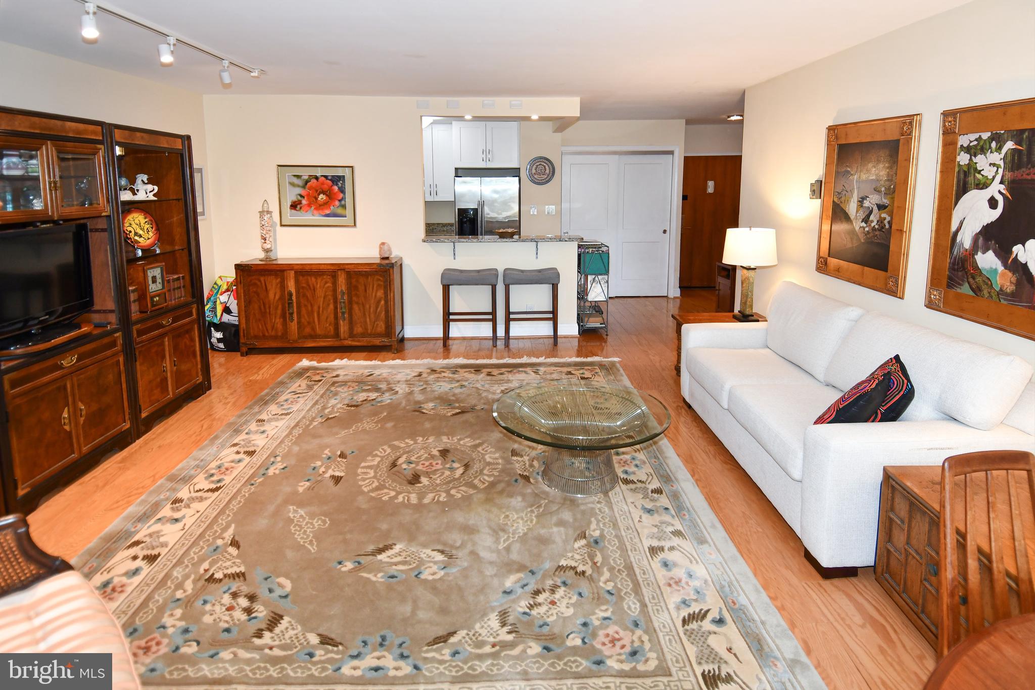 1435 4th Street Southwest, Unit B108 Washington, DC 20024 - Photo 13 of 57 a living room with furniture and a flat screen tv
