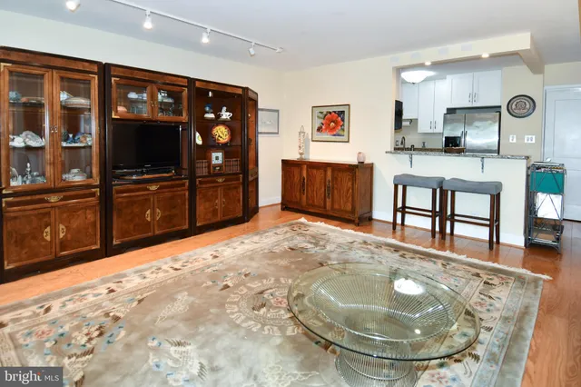 a living room with furniture a window and a dining table