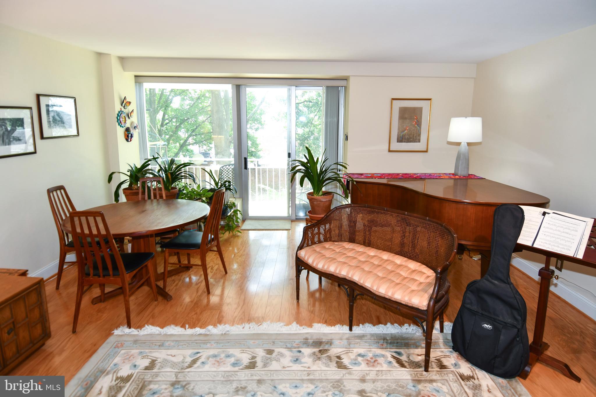1435 4th Street Southwest, Unit B108 Washington, DC 20024 - Photo 16 of 57 a living room with furniture a window and a dining table