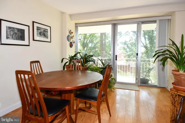 a view of balcony with wooden floor and outdoor seating
