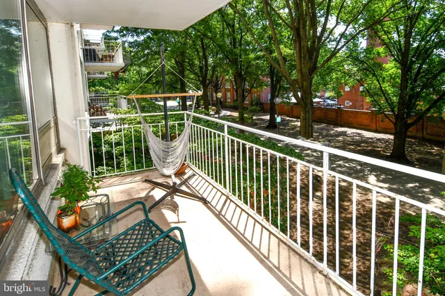 a bed room with a bed and a large mirror