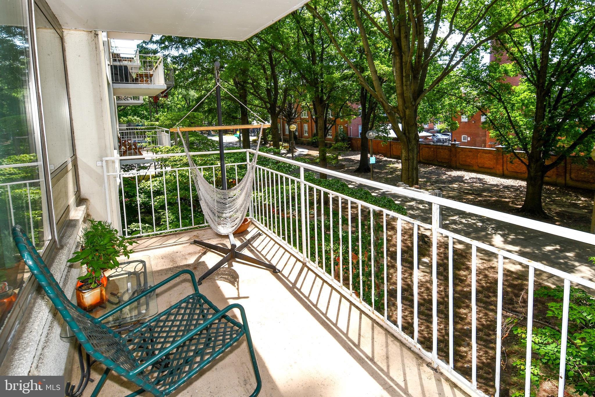 1435 4th Street Southwest, Unit B108 Washington, DC 20024 - Photo 18 of 57 a view of balcony with wooden floor and outdoor seating