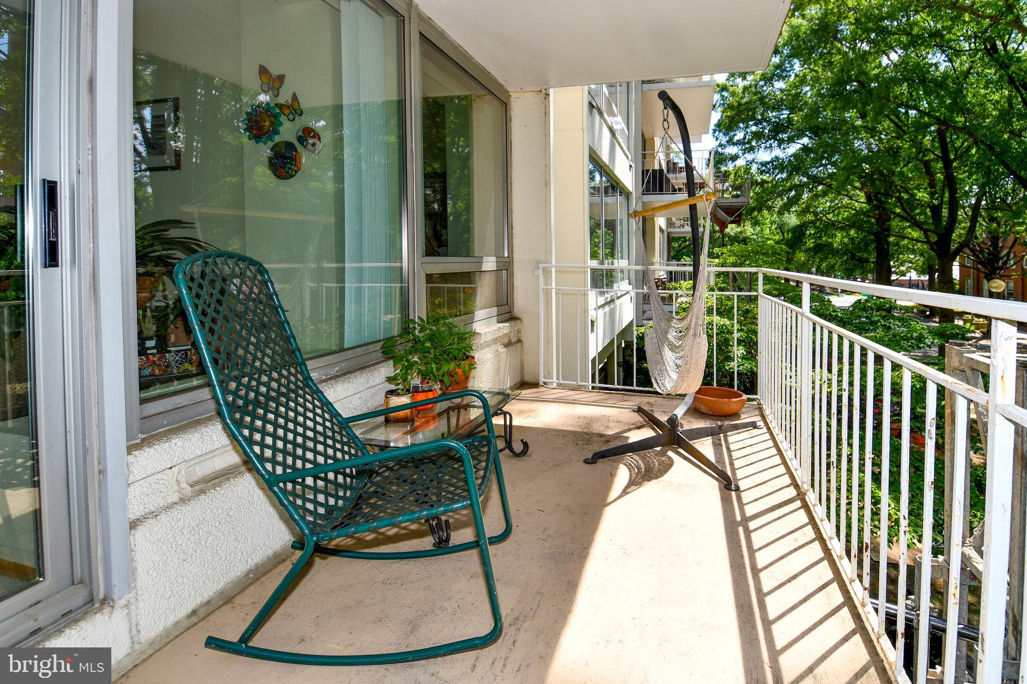 1435 4th Street Southwest, Unit B108 Washington, DC 20024 - Photo 19 of 57 a view of balcony with wooden floor and outdoor seating