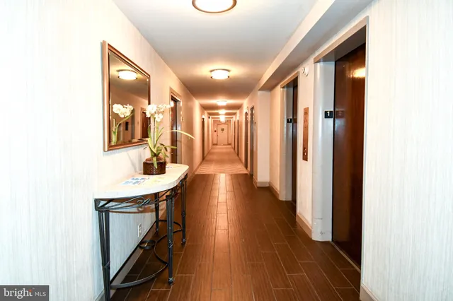 a view of a swimming pool with a seating space