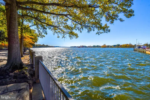 a roof deck with table and chairs