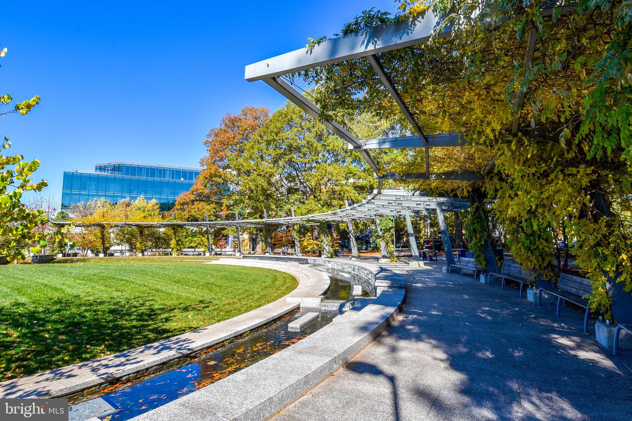 1435 4th Street Southwest, Unit B108 Washington, DC 20024 - Photo 45 of 57 a view of a swimming pool with a patio and a garden