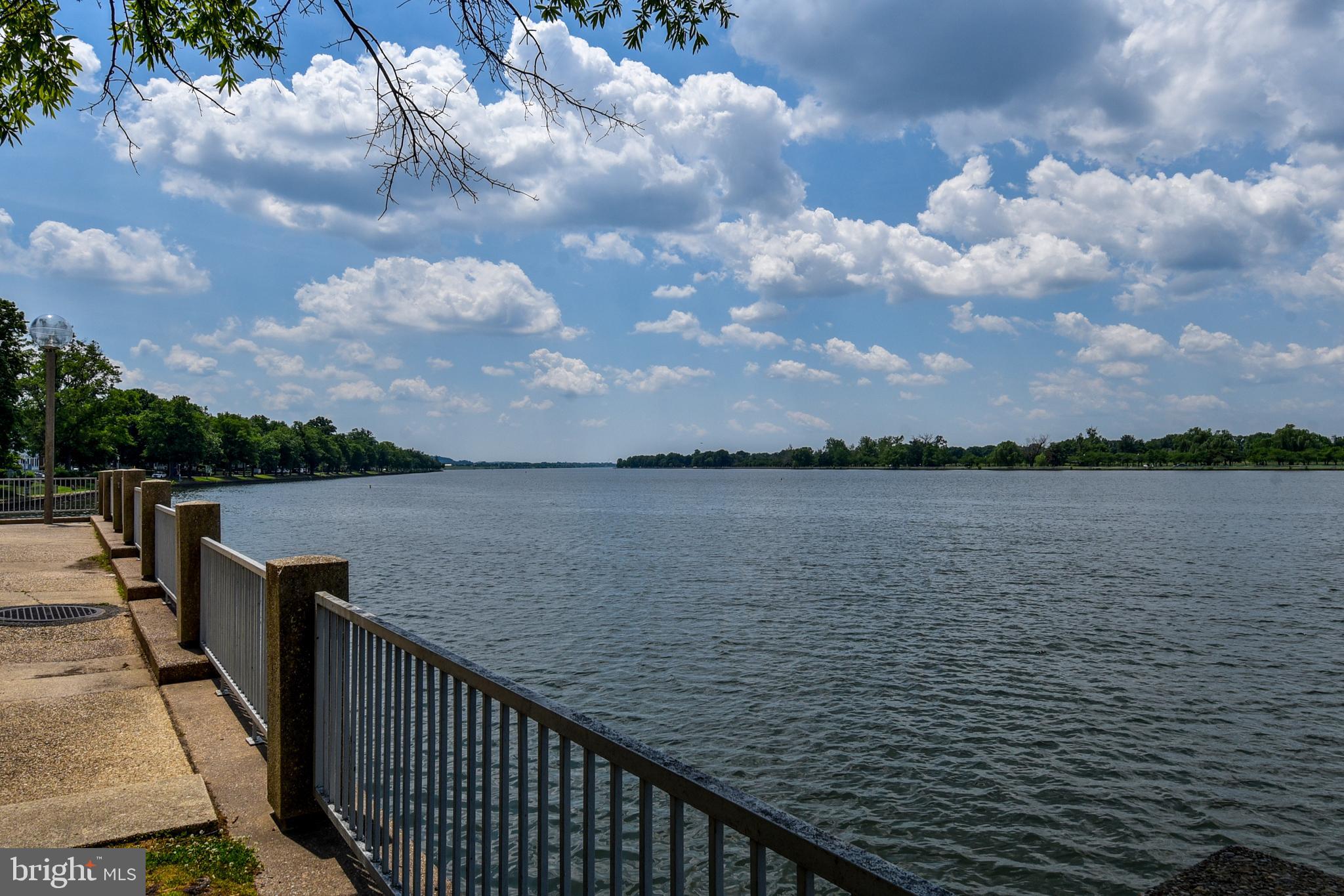 1435 4th Street Southwest, Unit B108 Washington, DC 20024 - Photo 49 of 57 a balcony with wooden floor and lake