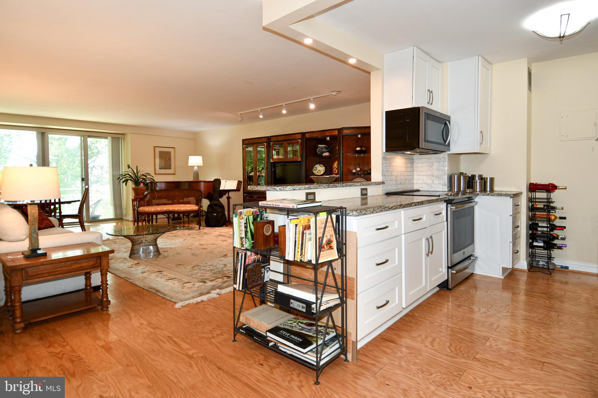 1435 4th Street Southwest, Unit B108 Washington, DC 20024 - Photo 5 of 57 a kitchen with stainless steel appliances a stove top oven and a refrigerator