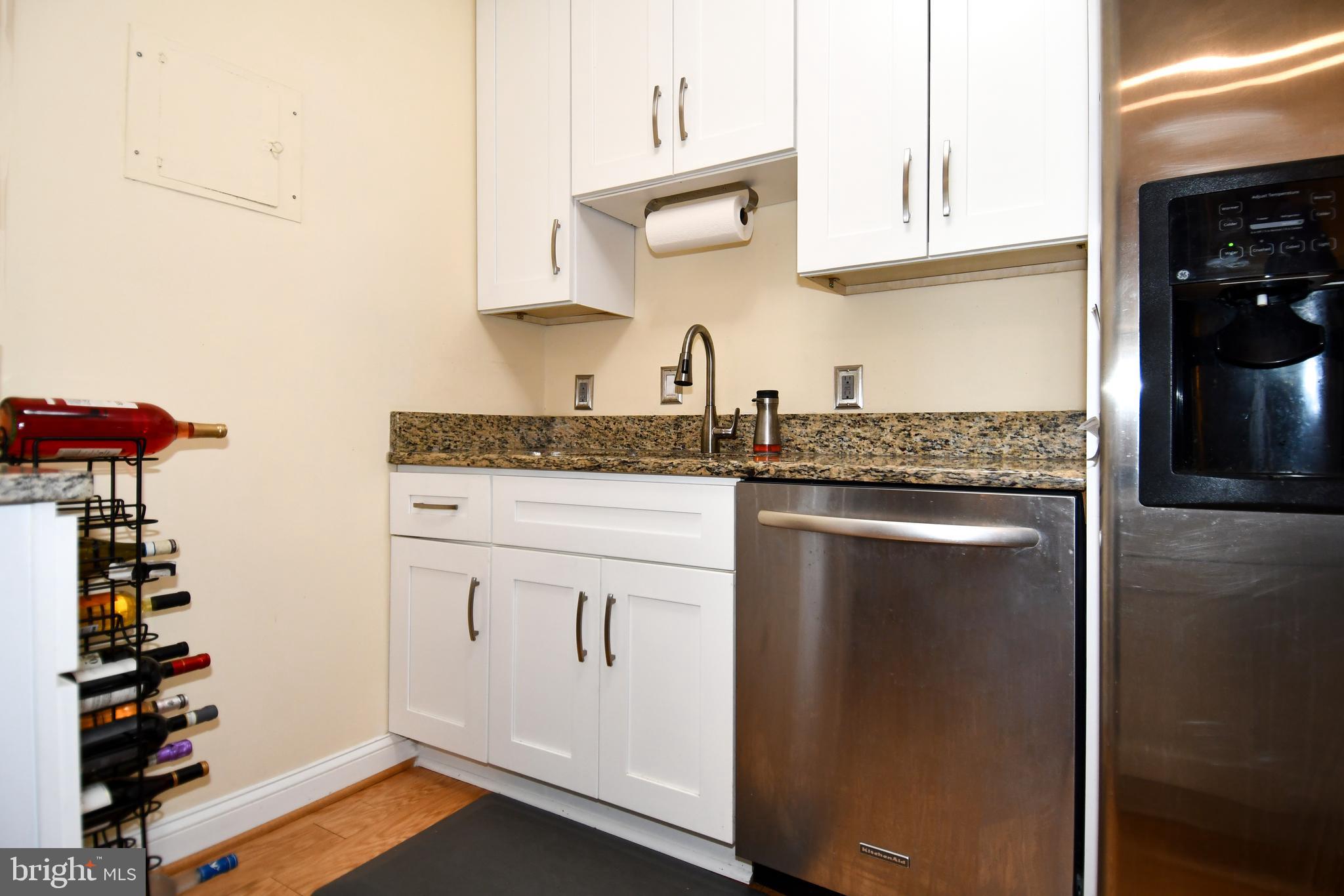 1435 4th Street Southwest, Unit B108 Washington, DC 20024 - Photo 8 of 57 a kitchen with a sink and cabinets