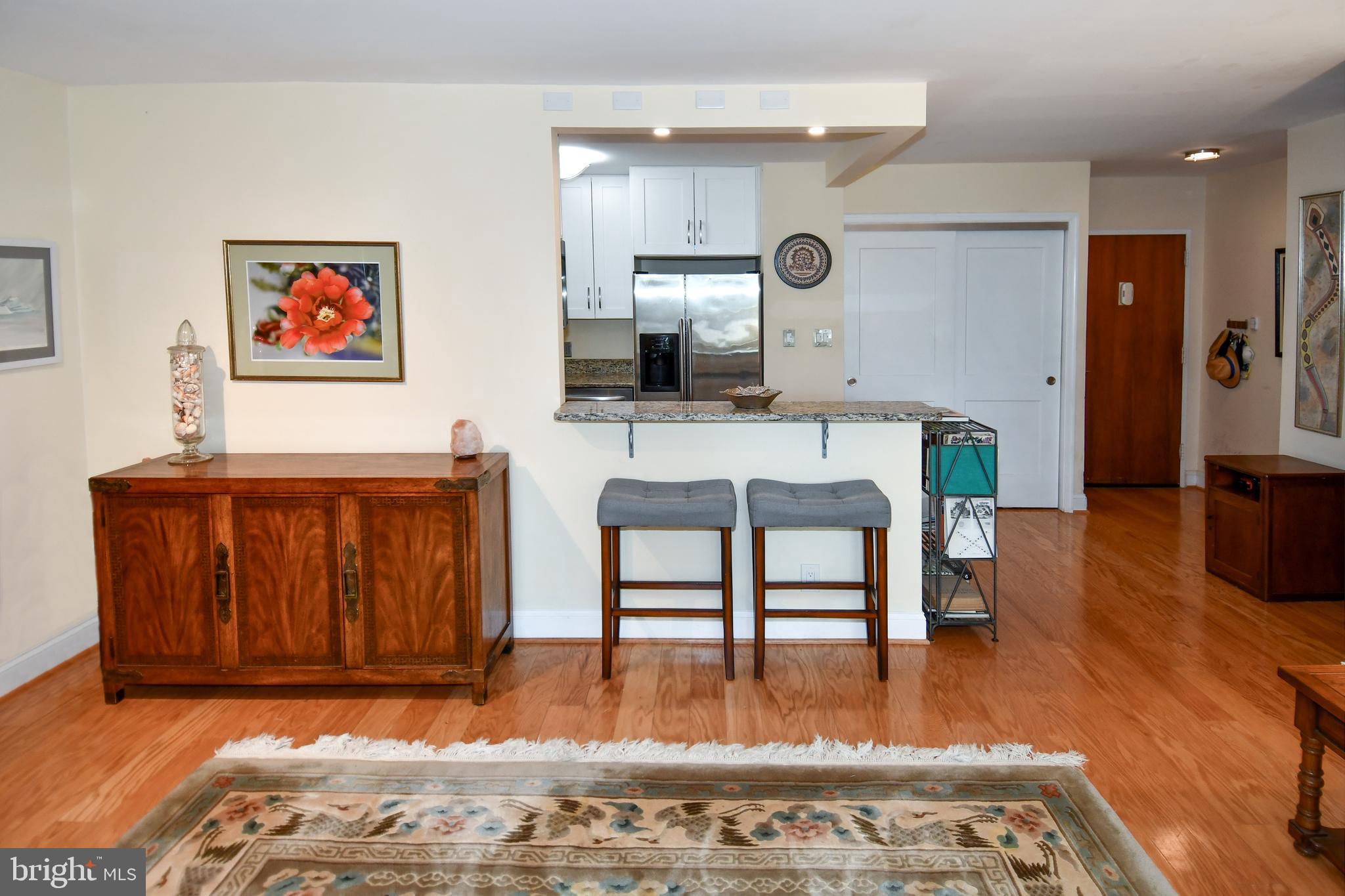 1435 4th Street Southwest, Unit B108 Washington, DC 20024 - Photo 9 of 57 a living room with furniture and a flat screen tv