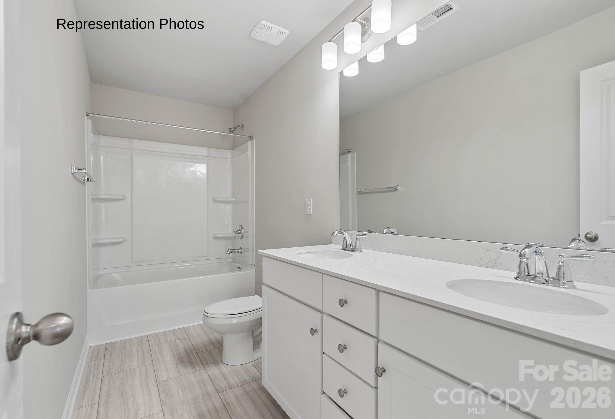 111 Pinnacle Crossing Shelby, NC 28152 - Photo 21 of 24 a spacious bathroom with a granite countertop sink a toilet mirror and shower