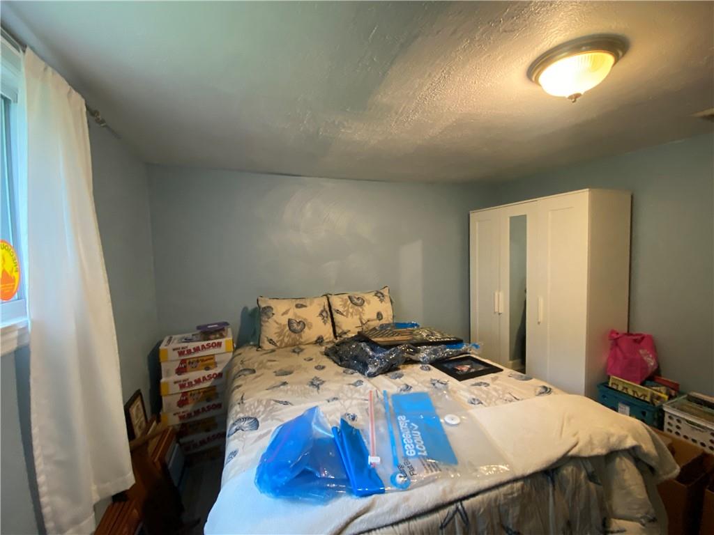 553 Browntown Road New Stanton, PA 15672 - Photo 12 of 20 a bedroom with a bed and a window