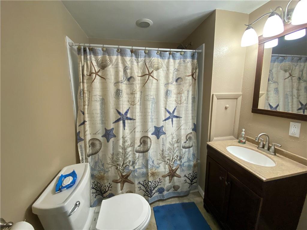 553 Browntown Road New Stanton, PA 15672 - Photo 14 of 20 a bathroom with a sink mirror vanity and toilet