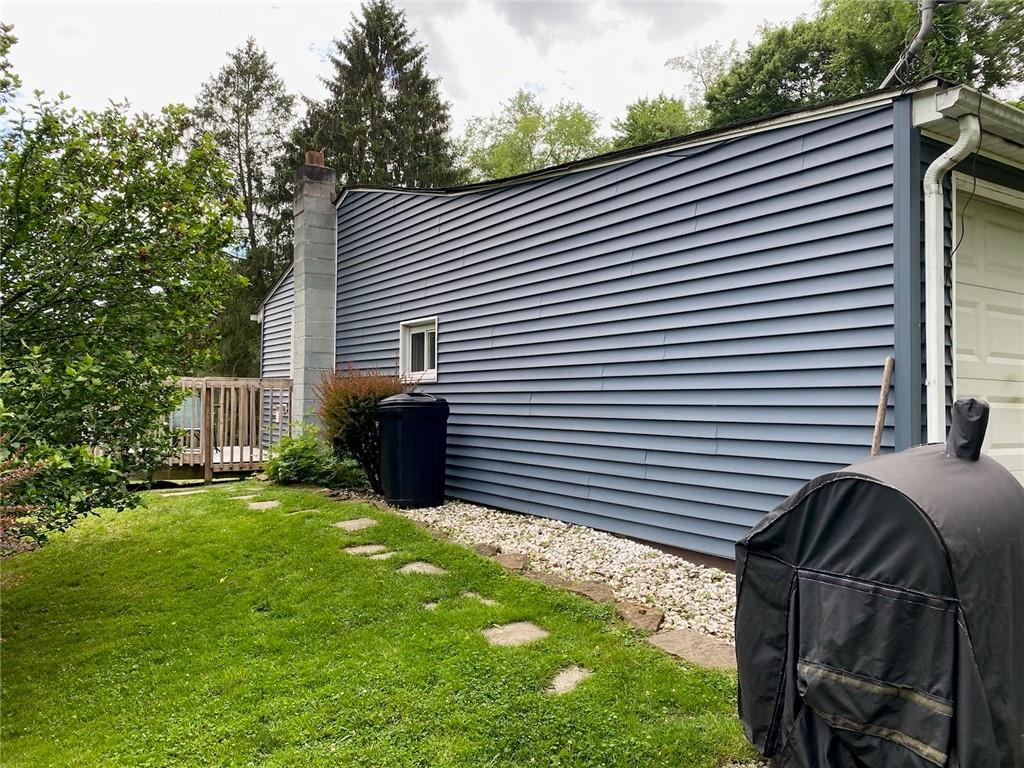 553 Browntown Road New Stanton, PA 15672 - Photo 18 of 20 a backyard of a house with table and chairs