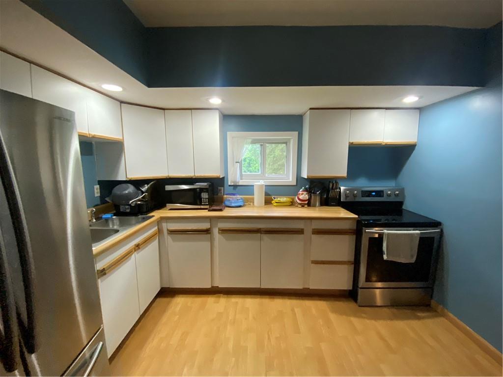 553 Browntown Road New Stanton, PA 15672 - Photo 6 of 20 a kitchen with a sink cabinets and appliances